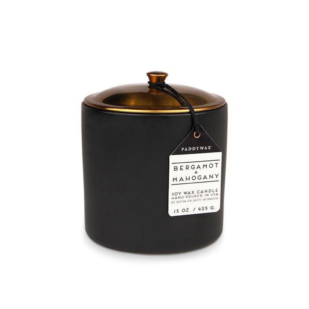 Hygge 15 oz Candle - Bergamot + Mahogany "Hygge"" (pronounced 'hooga') is the Danish word for coziness. Whether it's curling up with a good book or having a long dinner with friends