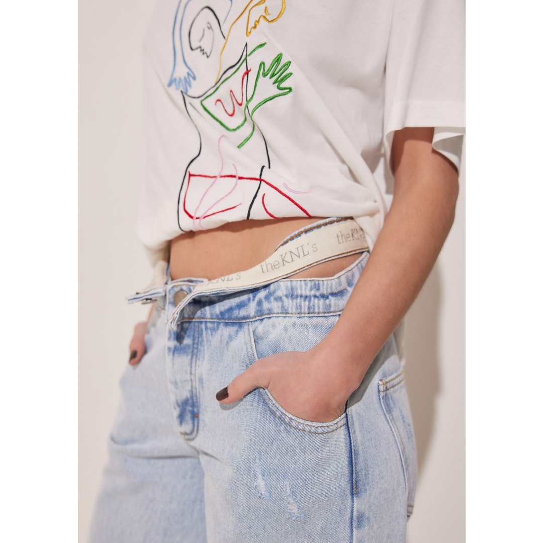 baggy fit with references to 90's style. They have side cutouts at the high-rise waistband version that bares a flash of skin or can be converted to mid-rise when the waistband is reversed showing the logo inside. The mid-rise option is trending leaving the top belt open to show the handmade logo band outside! They're made from thick denim which feels super stable and soft from the first wear and fit throughout the legs. Made in Greece of pure cotton