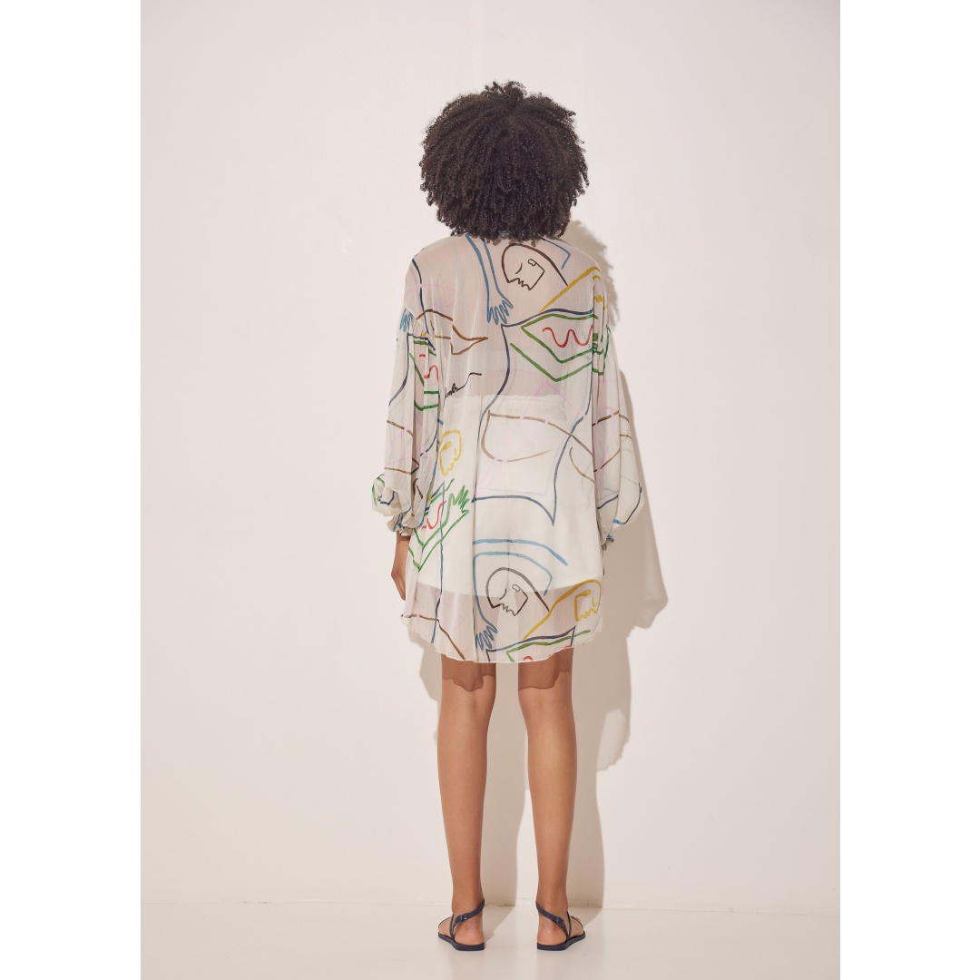 preppy style. The printed saturated pattern is a handmade painting on canvas design. With those loose sleeves and semi-transparent silk chiffon fabric