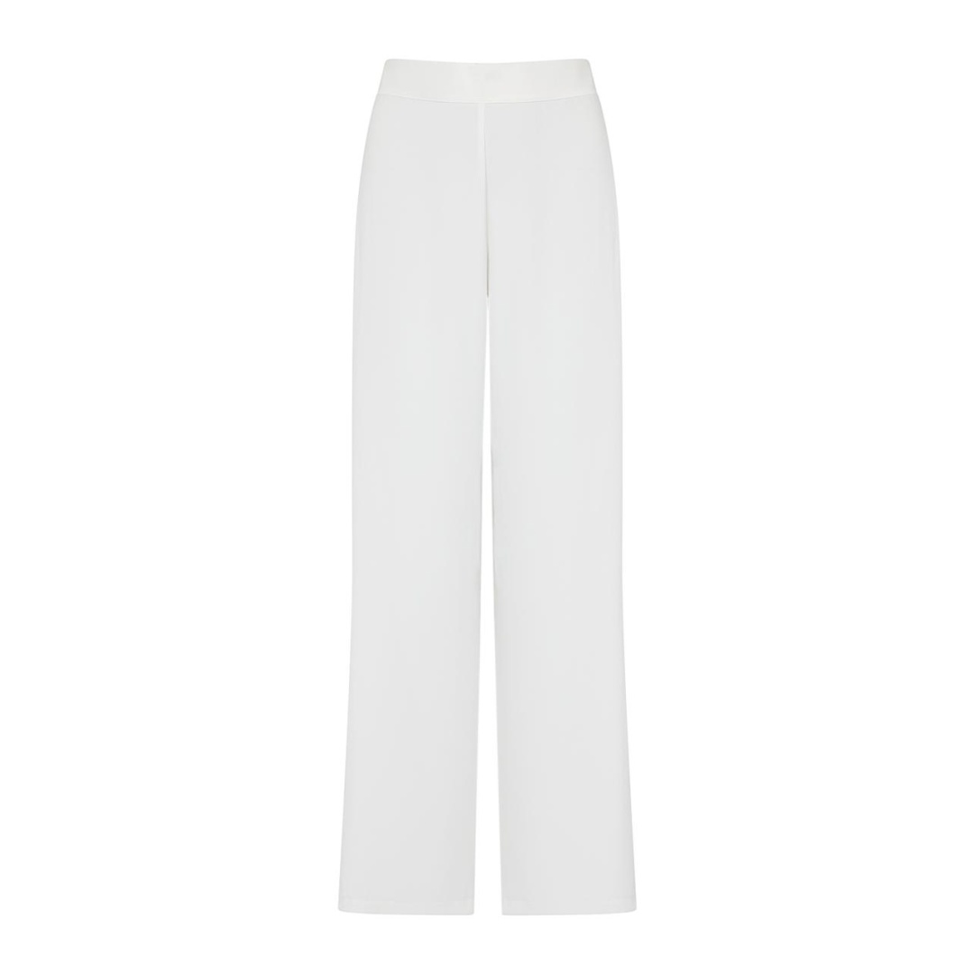 SUNLIGHT PANTS PURE WHITE The pants that your summer wardrobe definitely needs! Soft and airy fabric make Sunlight Pants is a versatile piece to style it as you wish and make it a morning to night choice.