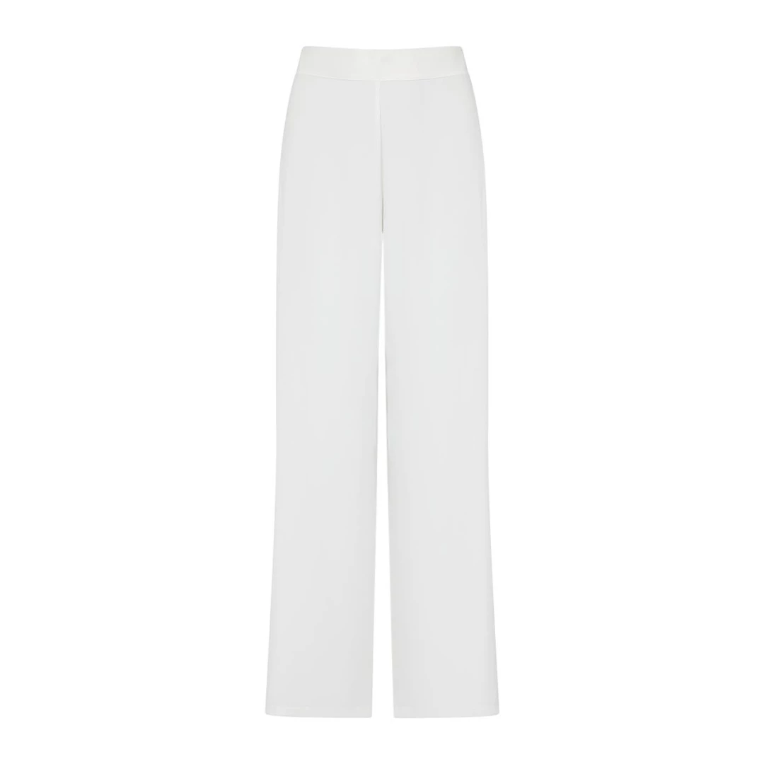 SUNLIGHT PANTS PURE WHITE The pants that your summer wardrobe definitely needs! Soft and airy fabric make Sunlight Pants is a versatile piece to style it as you wish and make it a morning to night choice.