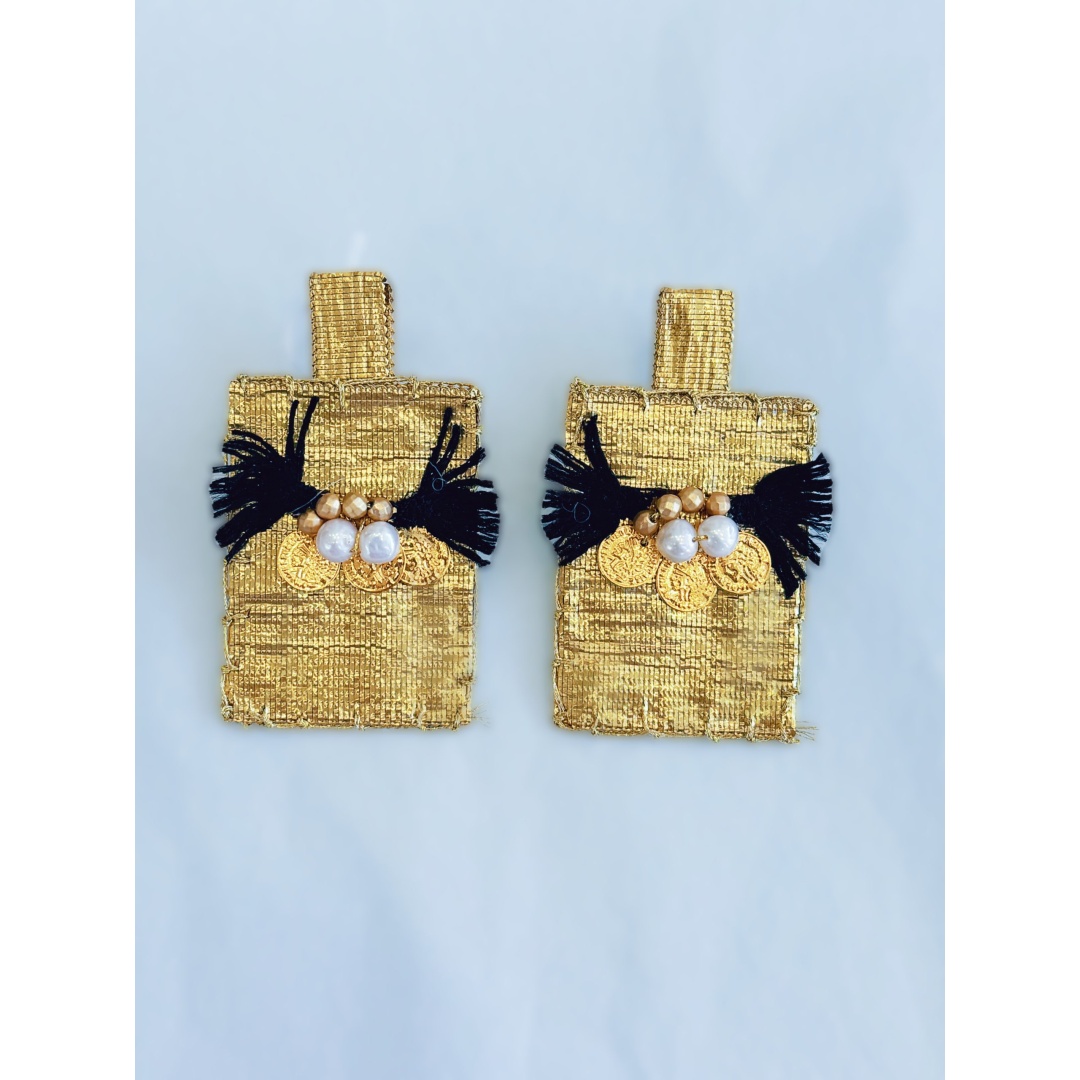 AIKATERINI EARRINGS Handmade earrings inspired by the Greek tradition made of embroidered fabric and semi-precious stones. Finished in golden embroidery.